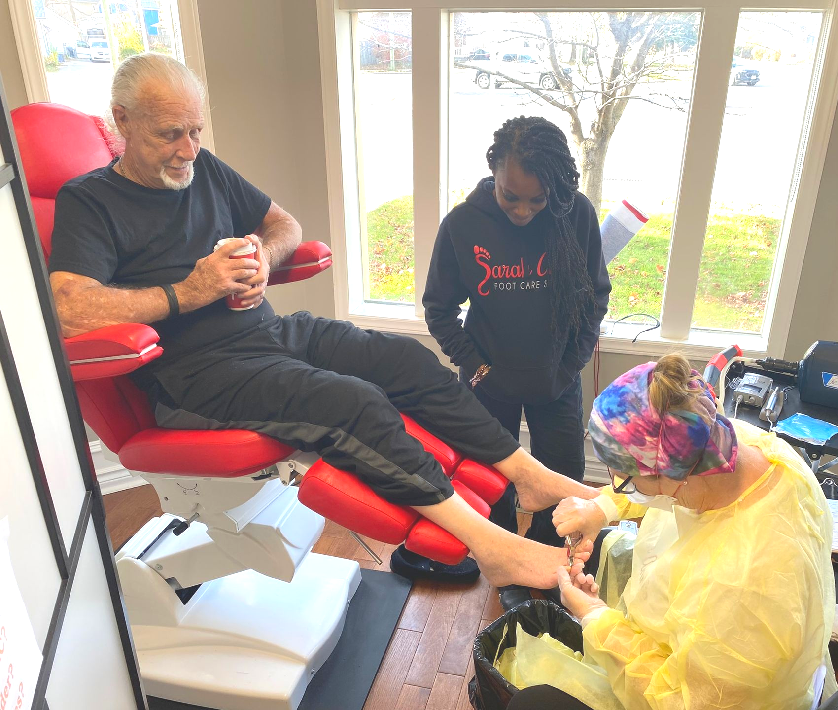RPN student performing advanced foot care on a patient during supervised clinical training at Sarah Ann's Foot Care EDU in Ontario.
