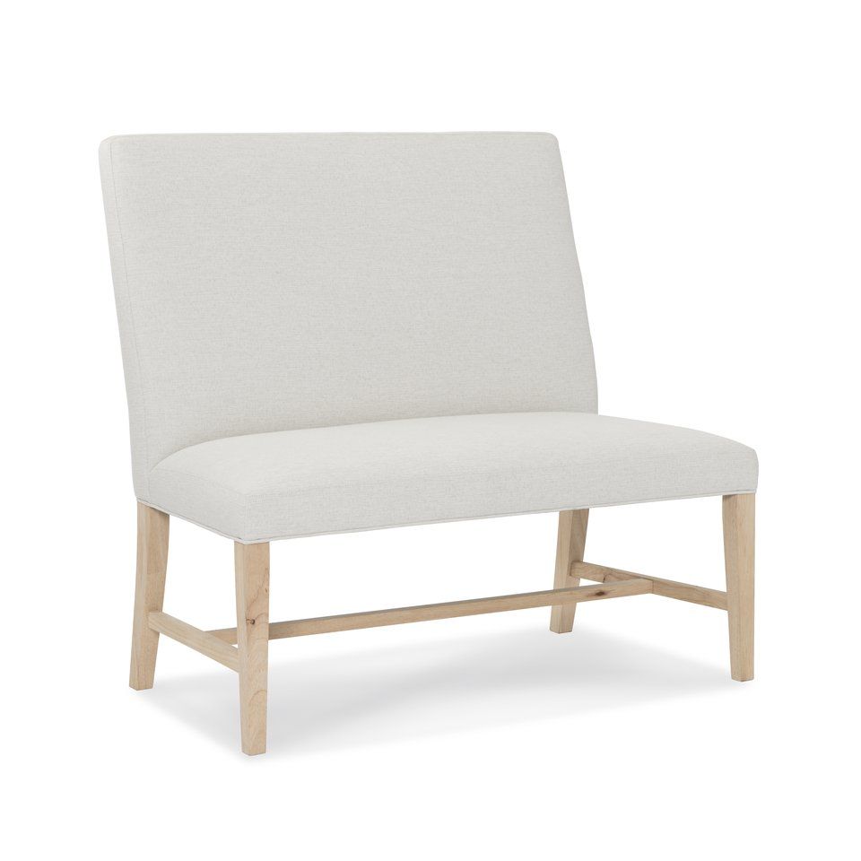 A white chair with wooden legs on a white background
