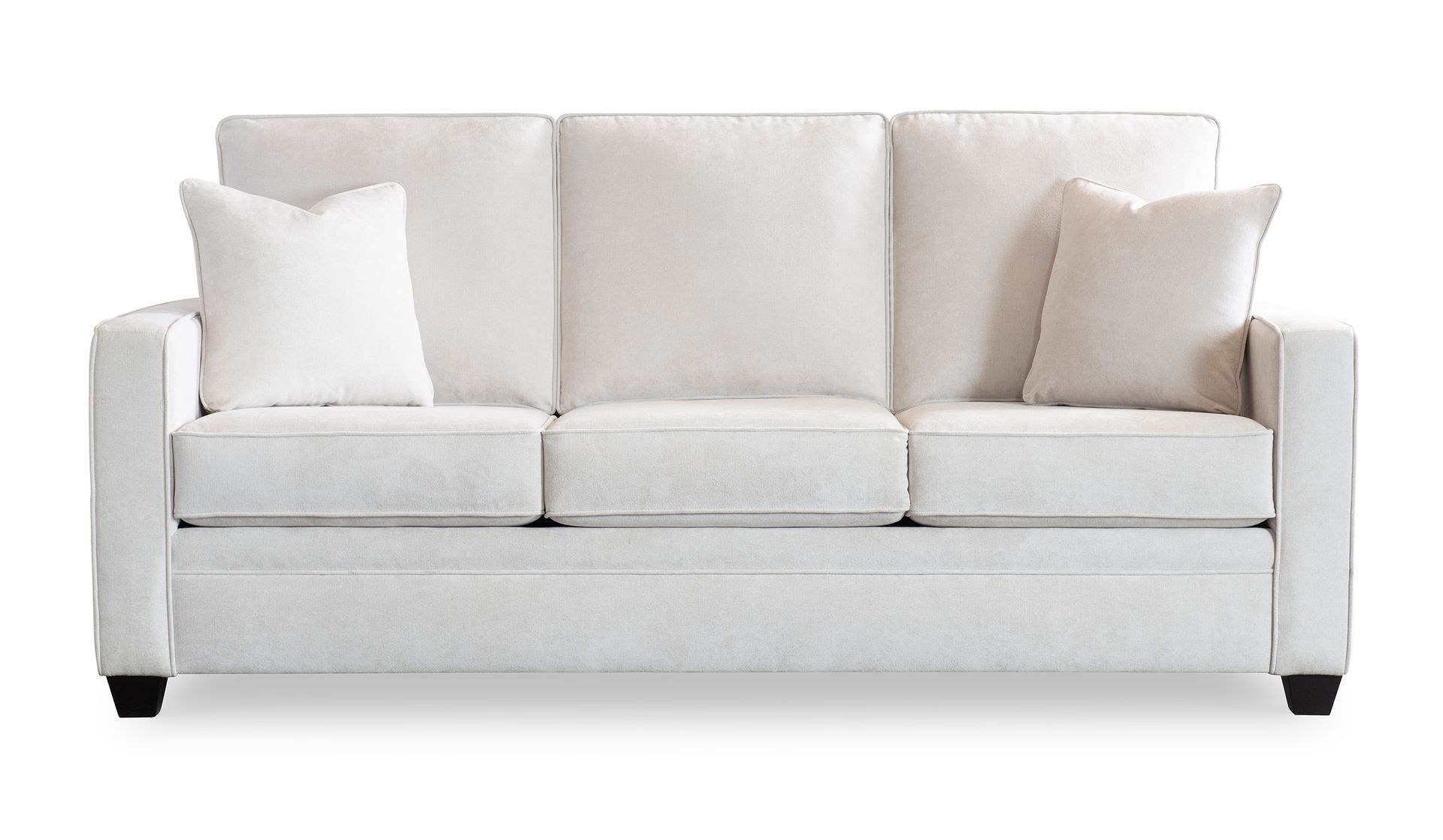 A white couch with two pillows on it on a white background.
