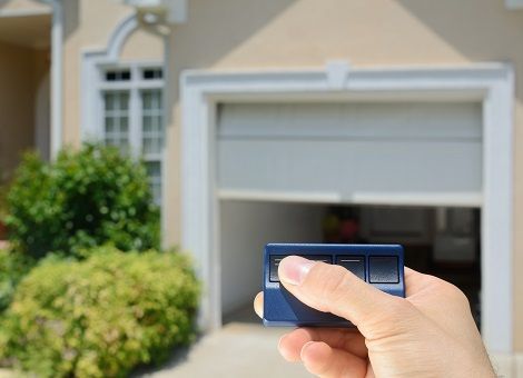 Worker Installing Garage Door — Cleveland, TN — McSpadden Garage Door Co