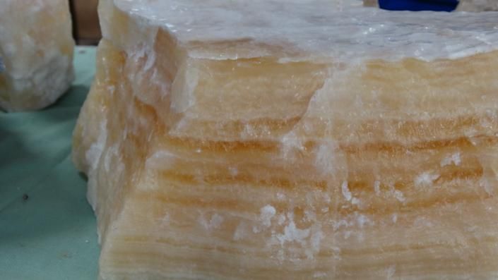 Stacked translucent amber salt blocks on a table