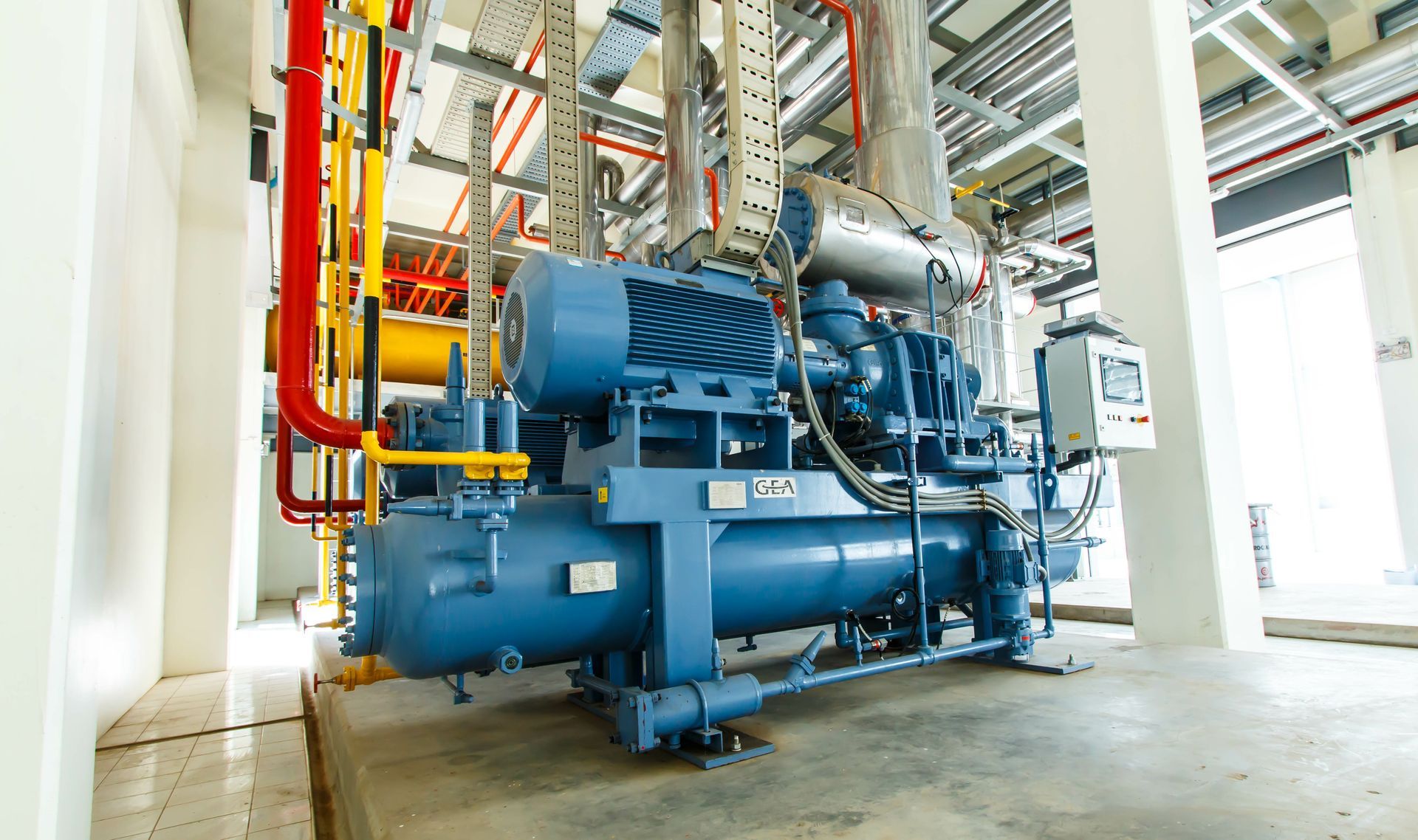 An industrial compressor refrigeration station at a manufacturing factory. An industrial compressor refrigeration station at a manufacturing factory.