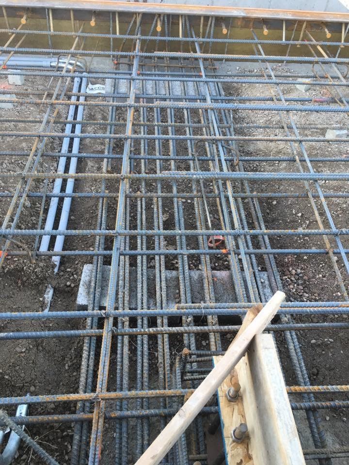A close up of a metal structure on a construction site.