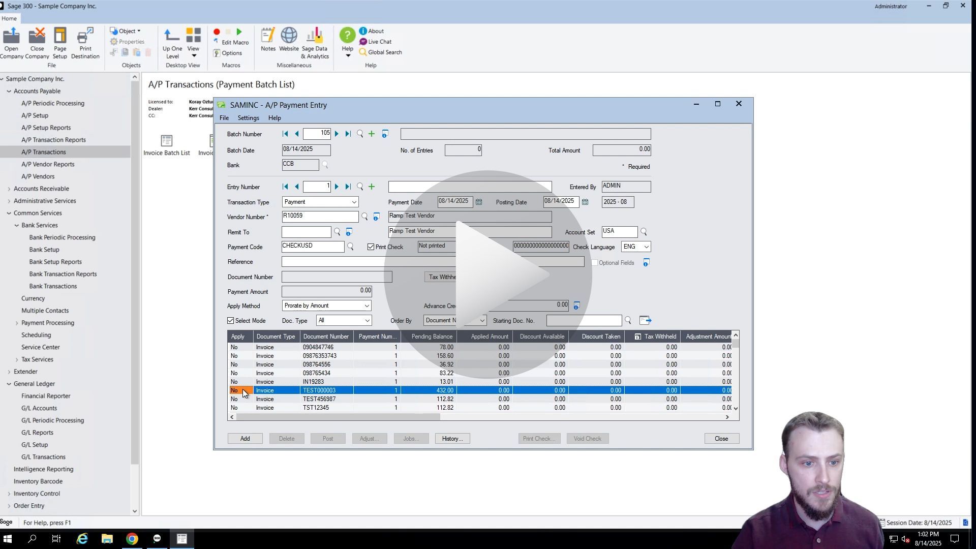 A man demonstrating software interface with data tables and input fields.