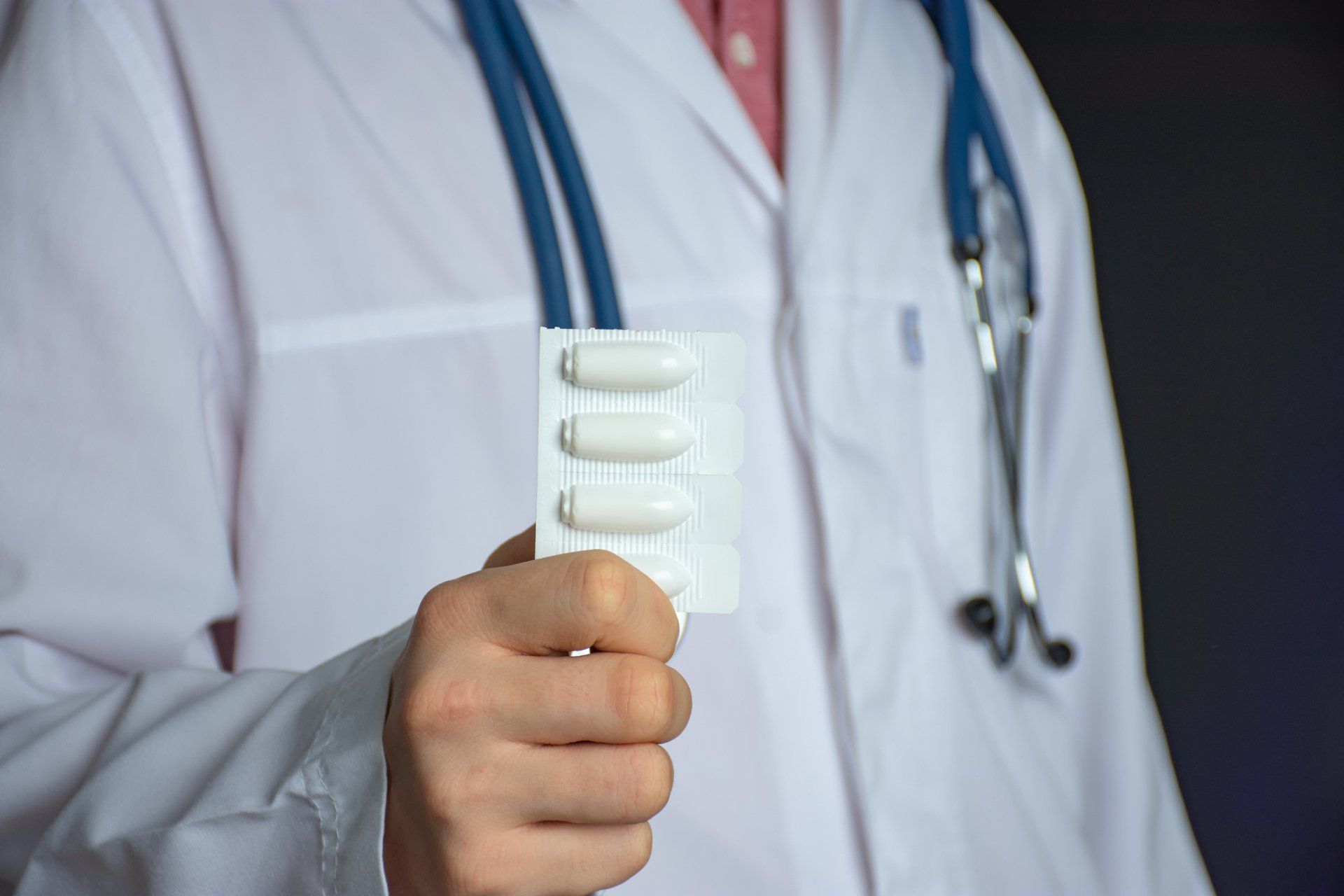 Doctor Holds Rectal Suppositories – Milwaukee, OR – The Oregon Hemorrhoid Clinic A doctor providing prolapse rectum care near Happy Valley, OR