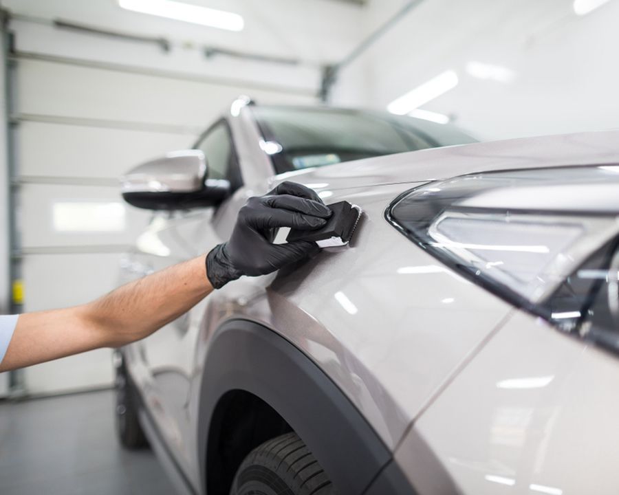 Applying Ceramic Protective Coating on Car — Shane’s Car Detailing & Office Cleaning in Taminda, NSW