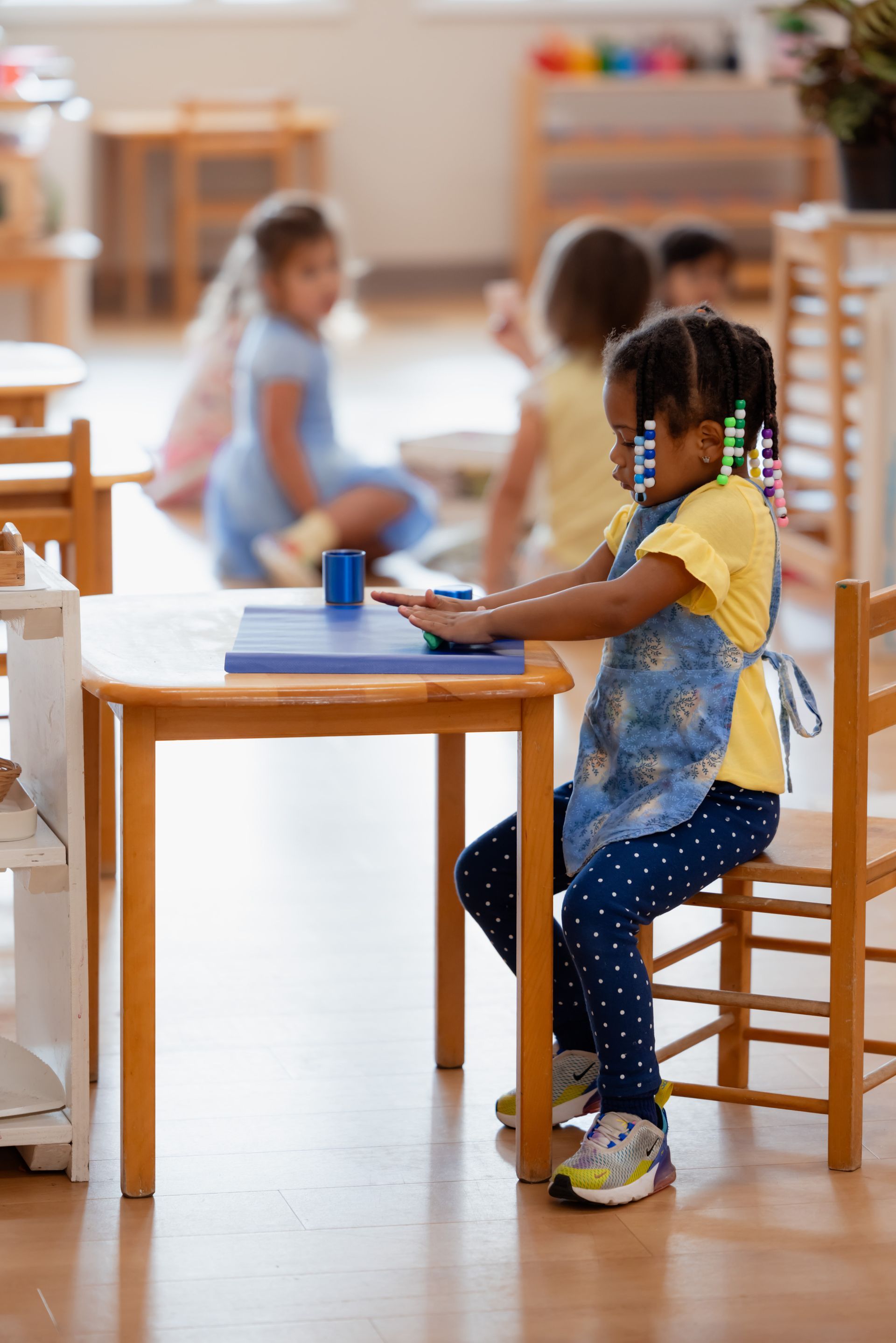 Montessori child working in the classroom