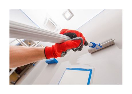 Painting Roller putting on fresh coat of paint on wall
