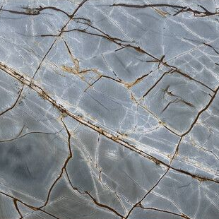 Gray marble slab with dark brown veins and fine white streaks
