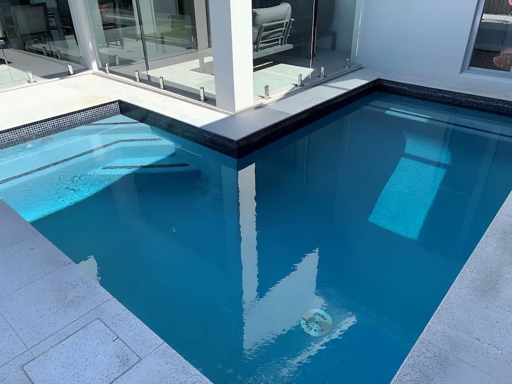 There is a Large Swimming Pool in the Middle of a House — Sun City Pools In Hyde Park, QLD