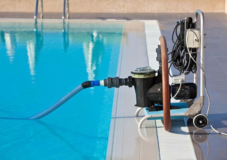 A Swimming Pool With a Pump Attached to It — Sun City Pools In Hyde Park, QLD
