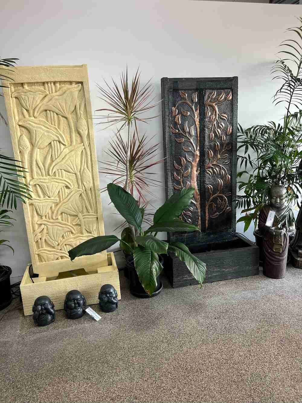 A Room Filled With Lots of Potted Plants and Statues — Sun City Pools In Hyde Park, QLD