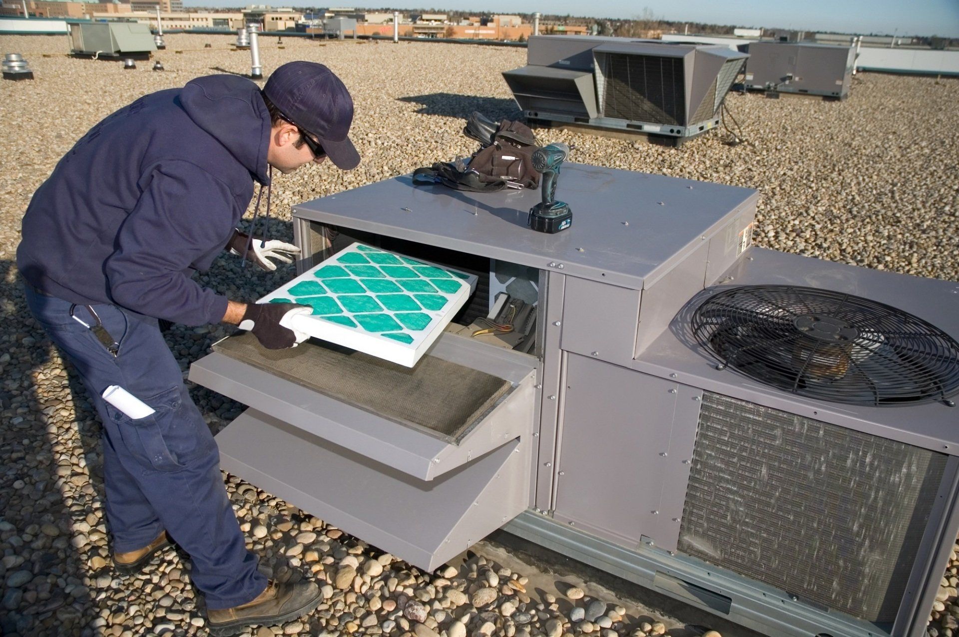 Man Fixing Aircon — Las Vegas, NV — Lin-Air