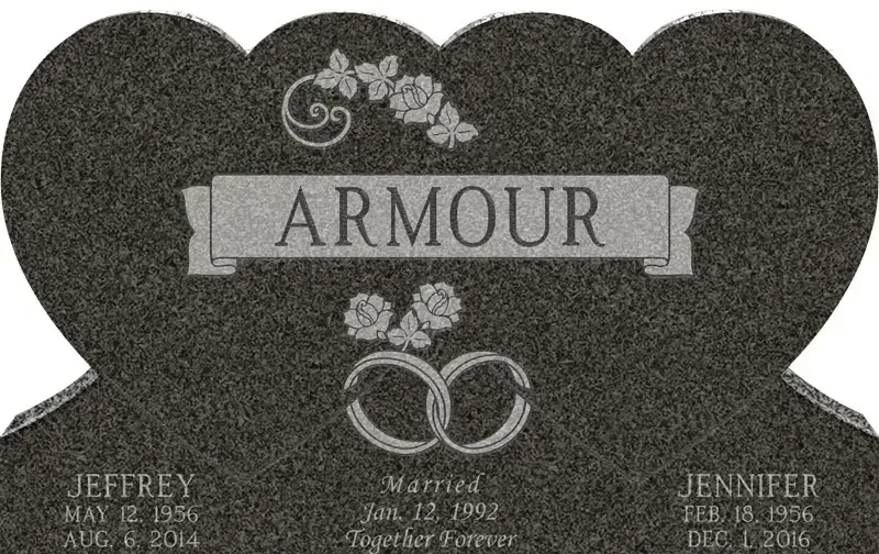 Gray headstone with “ARMOUR” and interlocking rings, engraved names at the bottom.