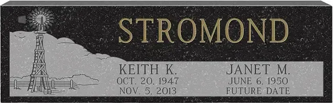 Memorial plaque with lighthouse and mountains, reading “STROMOND” with Keith K. and Janet M. dates.