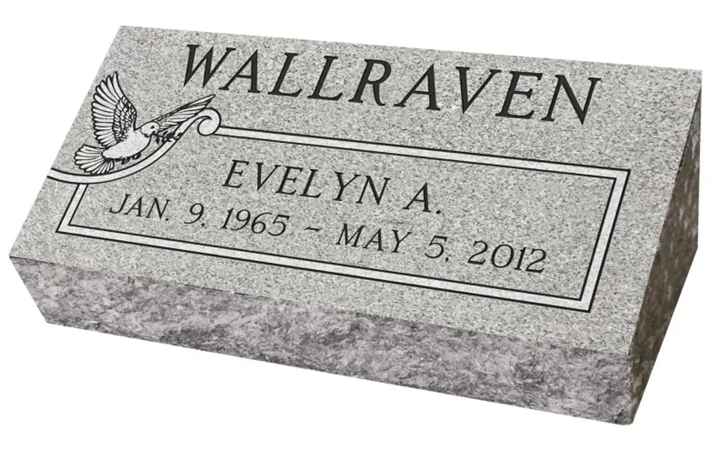 Gray gravestone engraved with “Wallraven” and “Evelyn A.” with dates Jan. 9, 1963–May 2, 2021.