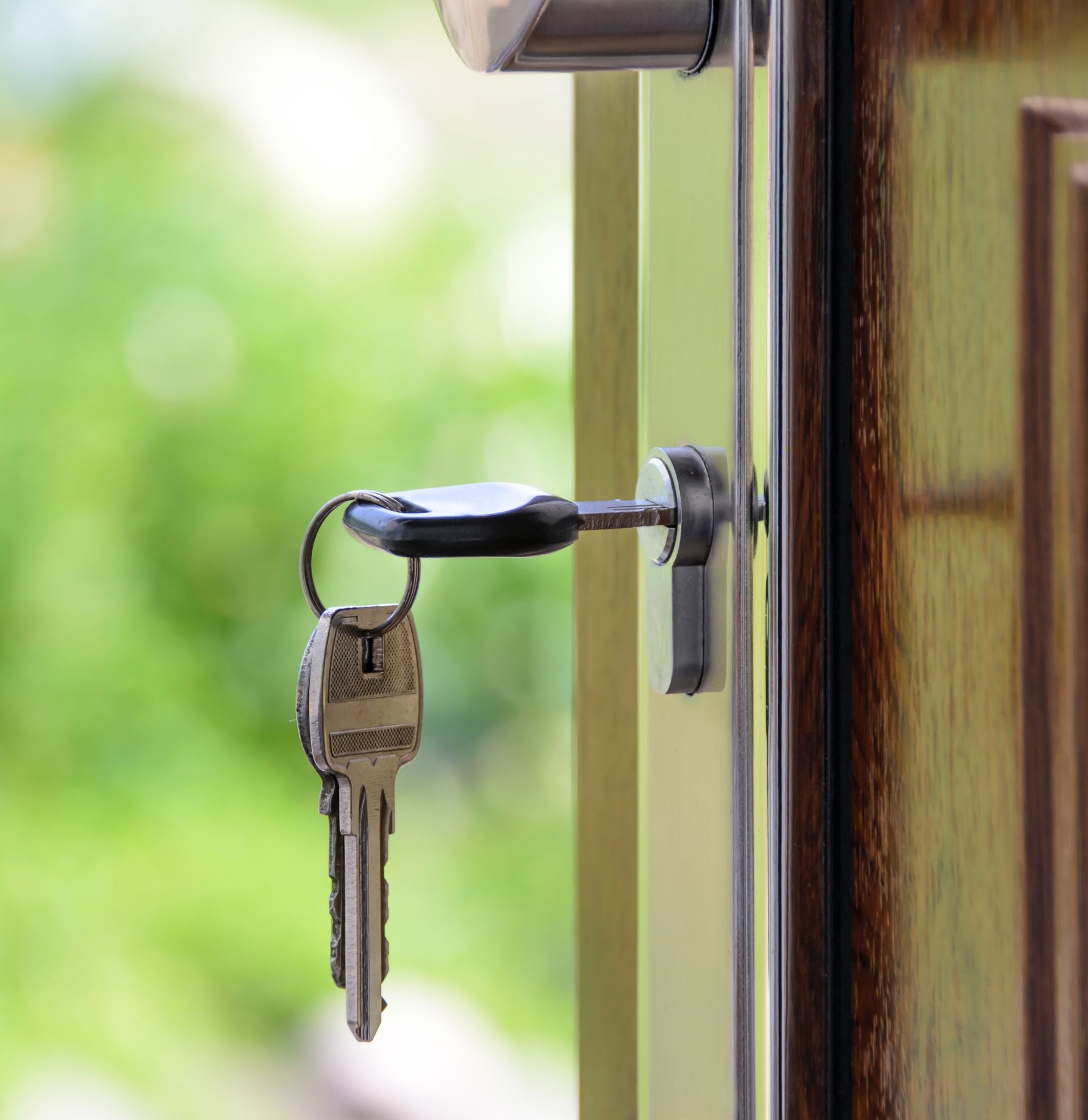 A close up of a key in a door lock.