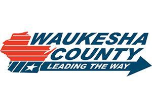 red and navy blue Waukesha County logo