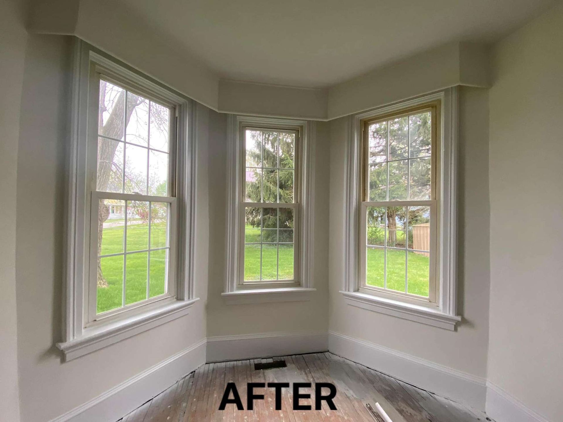 A room with a lot of windows and the word after on the bottom.