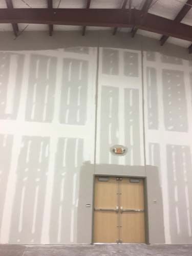 There is a door in the middle of the room.