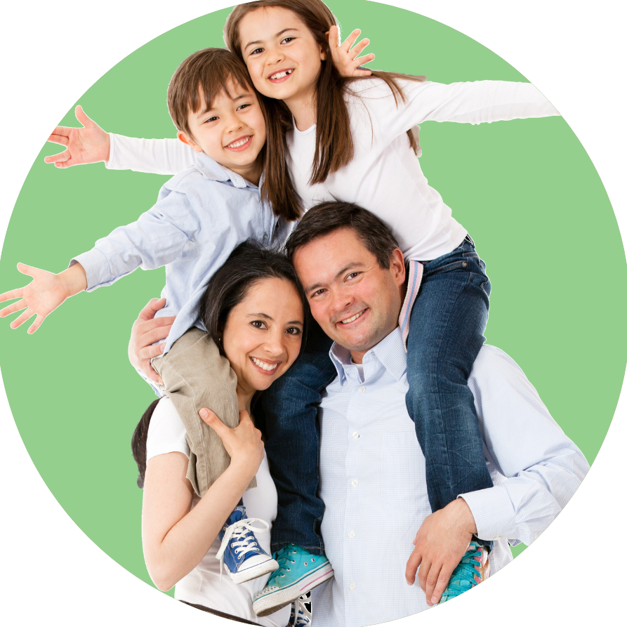 A man and woman are carrying two children on their shoulders.