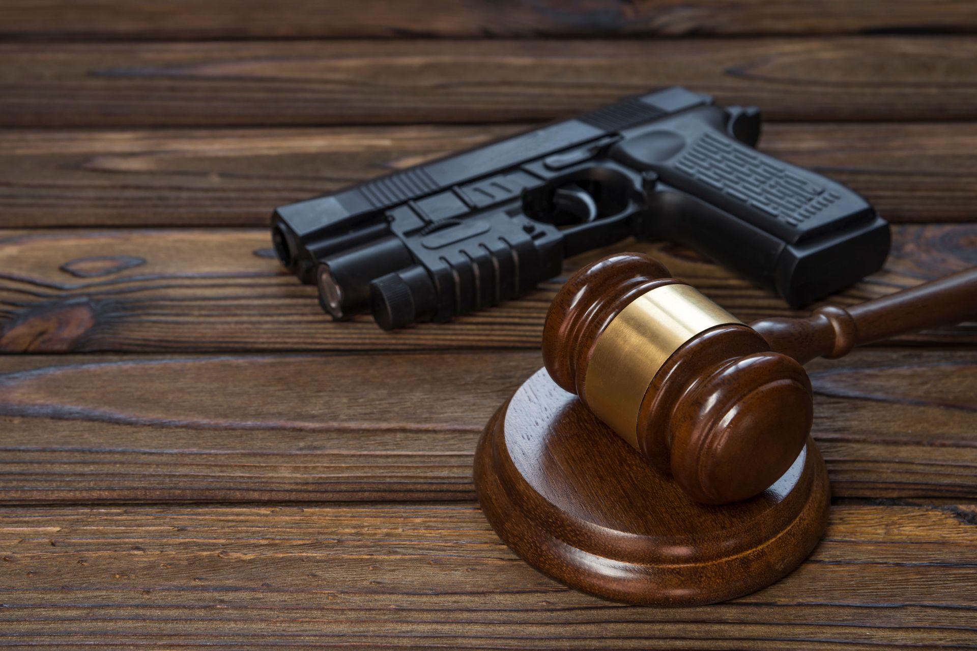 Handgun beside a gavel