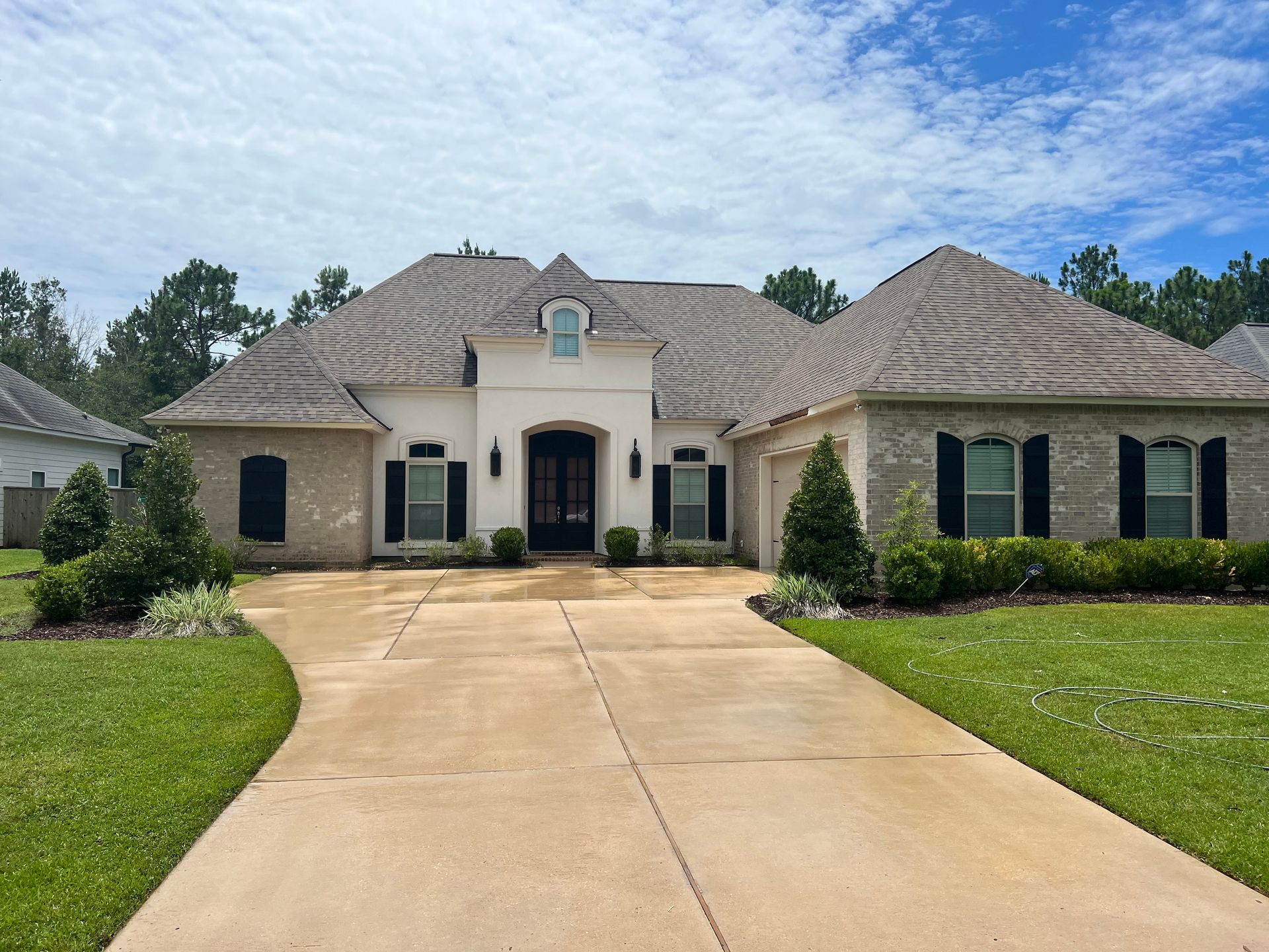 A large house with a driveway leading to it