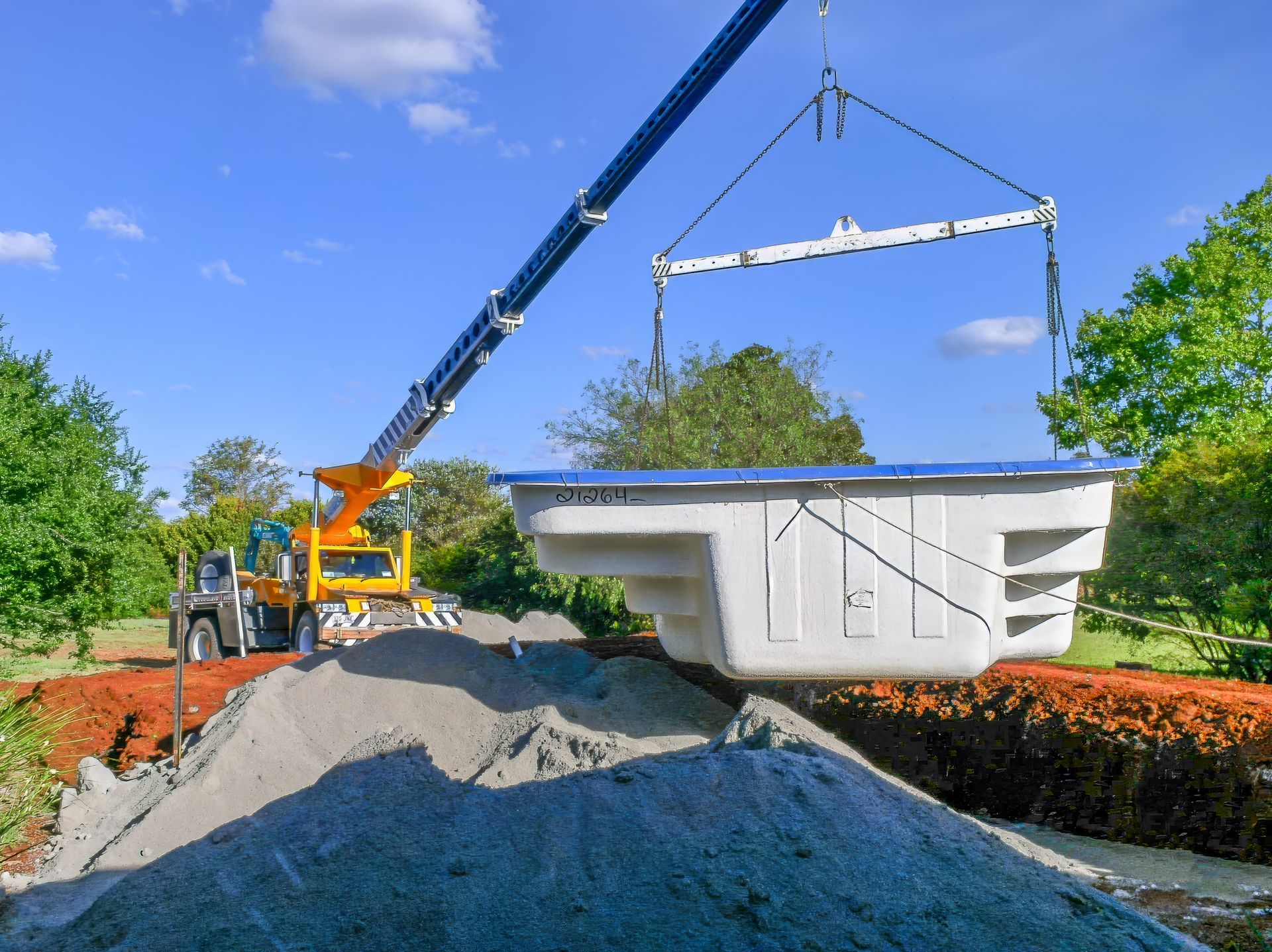Pool Lifting Services | Oklahoma | MRC LIFTING SERVICES A white truck with a crane attached to the back of it