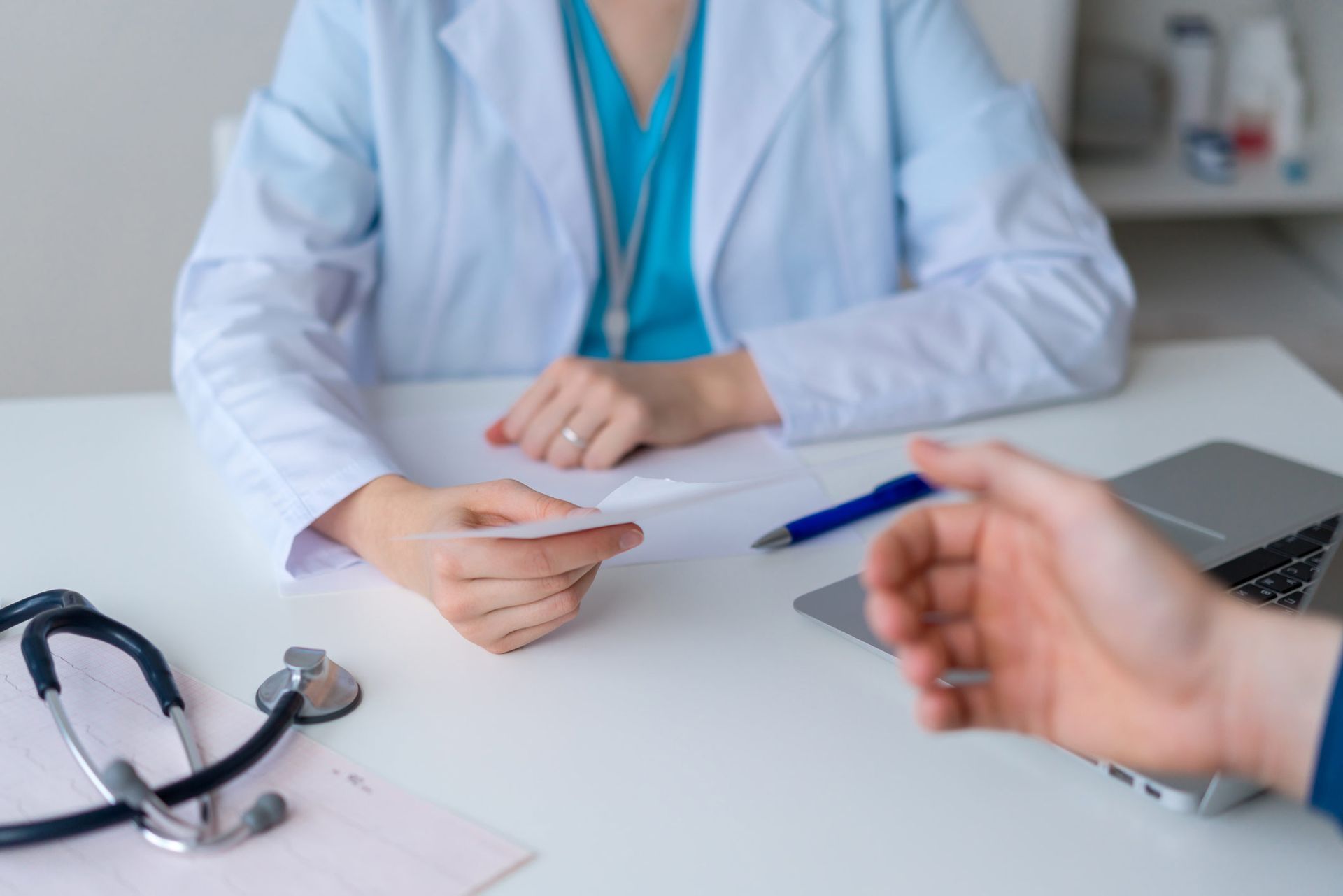 Unrecognizable Doctor Prescribing Pills And Drugs To Patient — Greensburg, IN — DC Integrated Medicine
