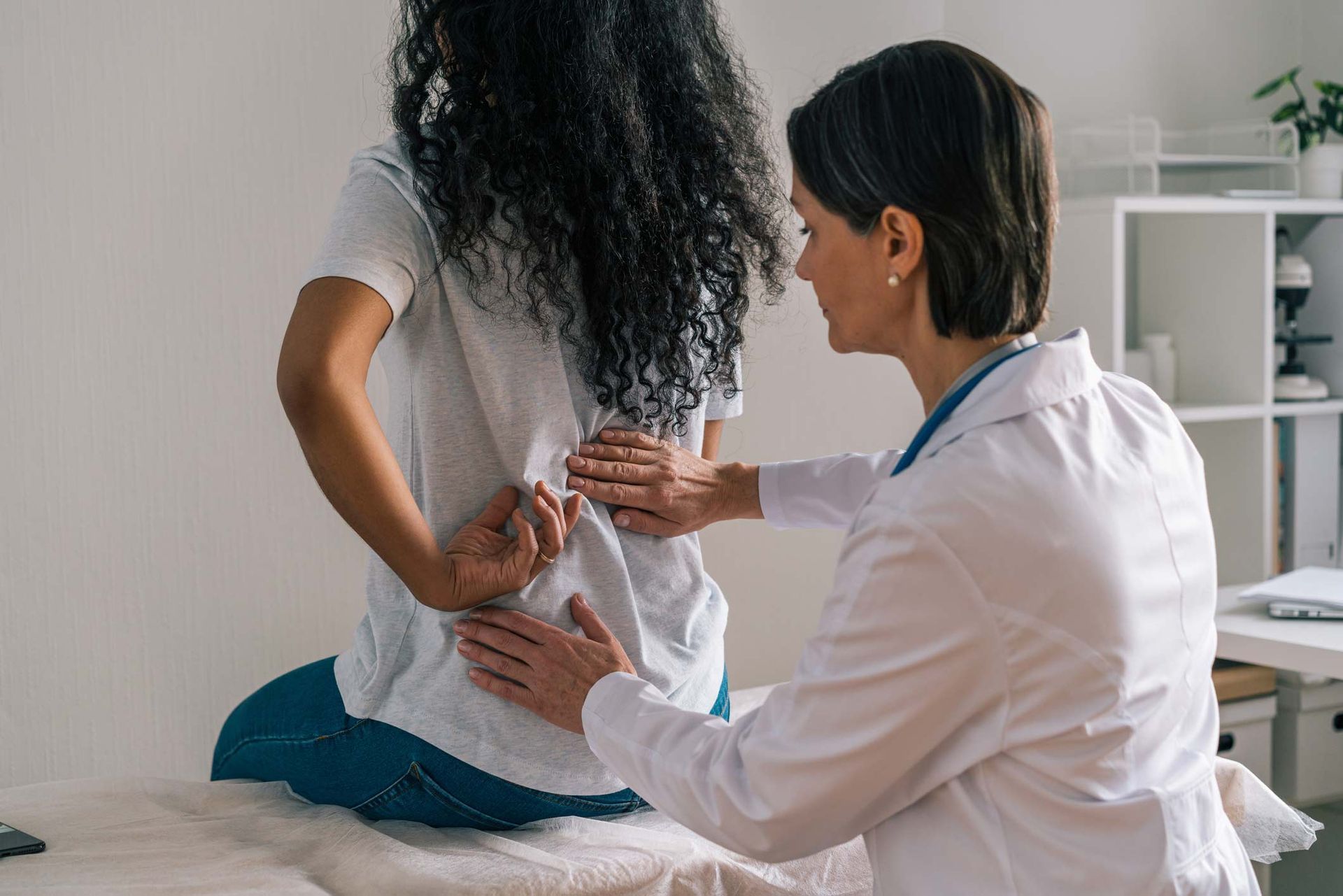 Faceless African American Female Patient Complaining About Painful Rheumatism To Orthopedist — Greensburg, IN — DC Integrated Medicine Faceless African American Female Patient Complaining About Painful Rheumatism To Orthopedist — Greensburg, IN — DC Integrated Medicine