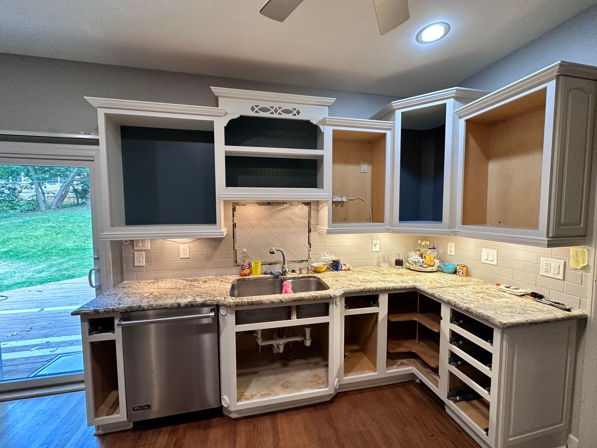 A kitchen with stainless steel appliances and granite counter tops is being remodeled.