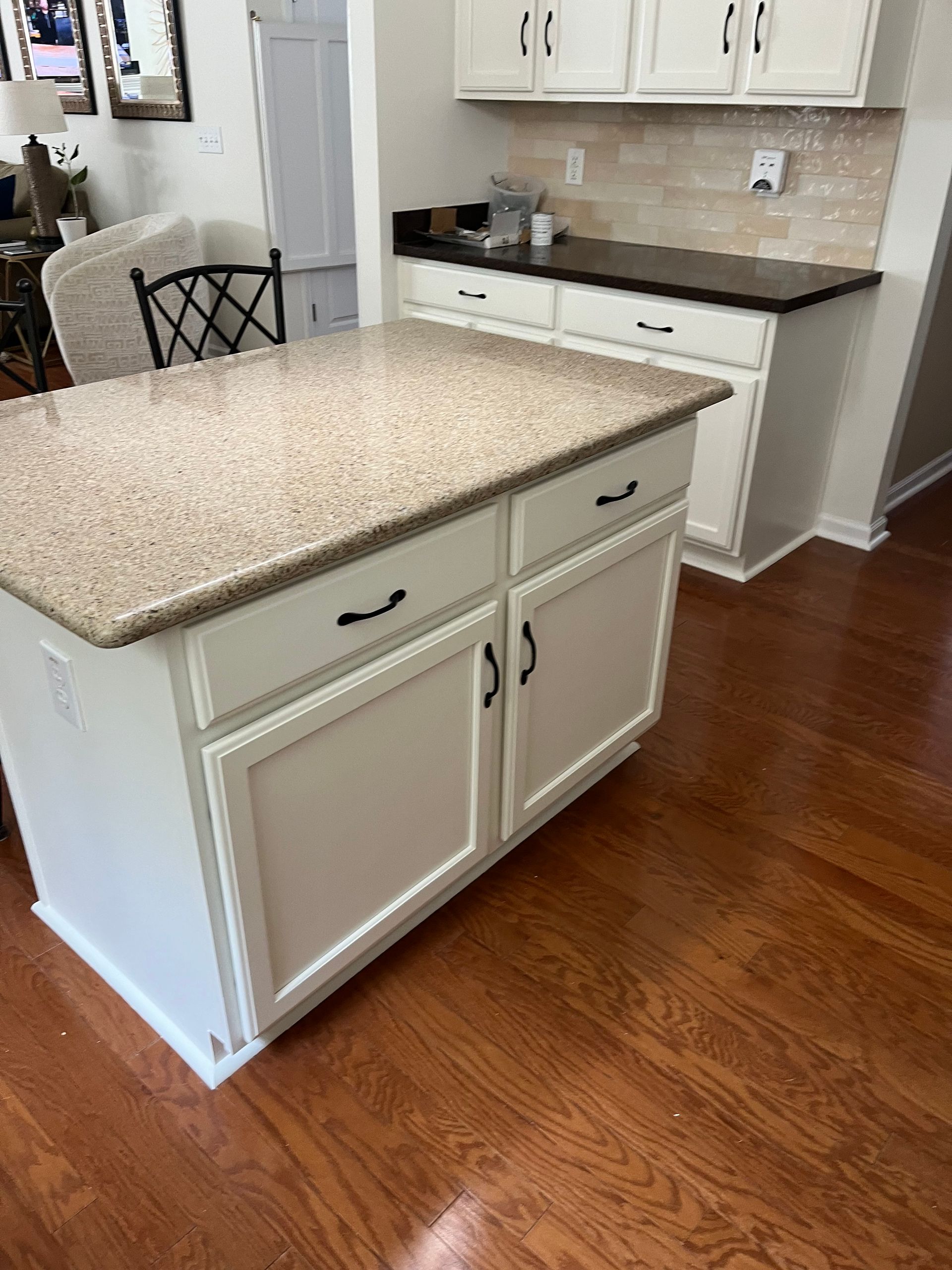 A kitchen with a large island in the middle of it.