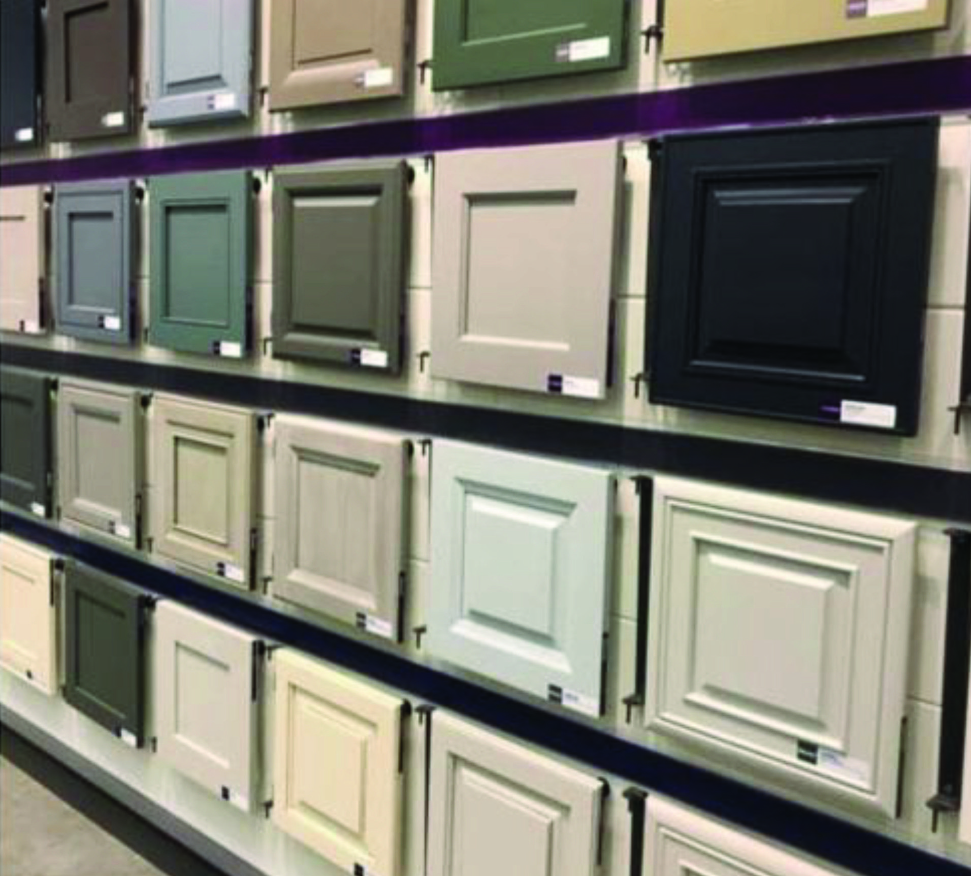 A display of different colored cabinet doors in a store