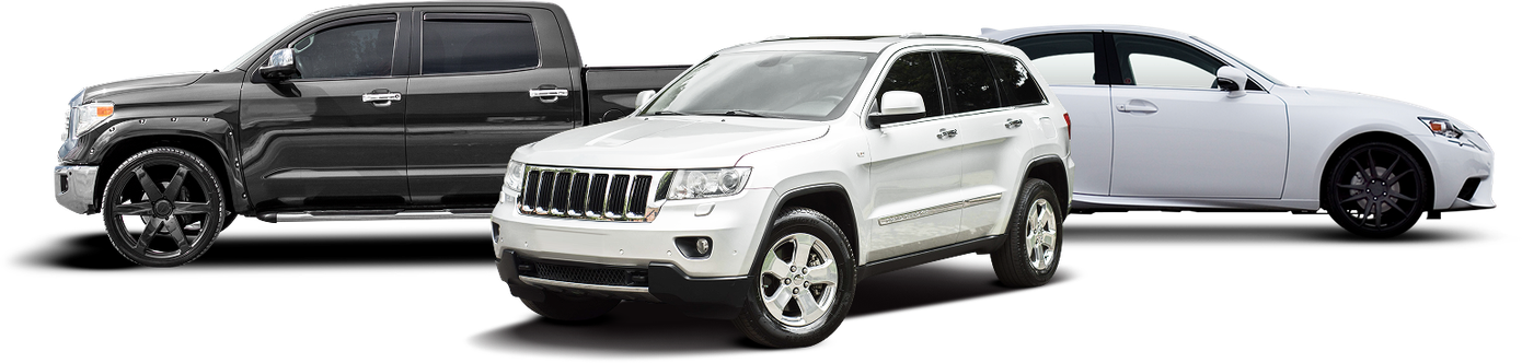 A dark gray pickup truck, a white SUV, and a white sedan are parked side-by-side against a plain white background. | Avon Auto & Truck