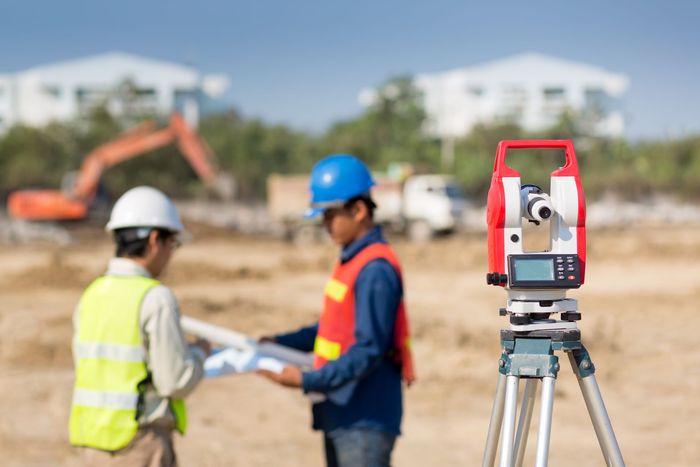 A land surveyor using an alto meter