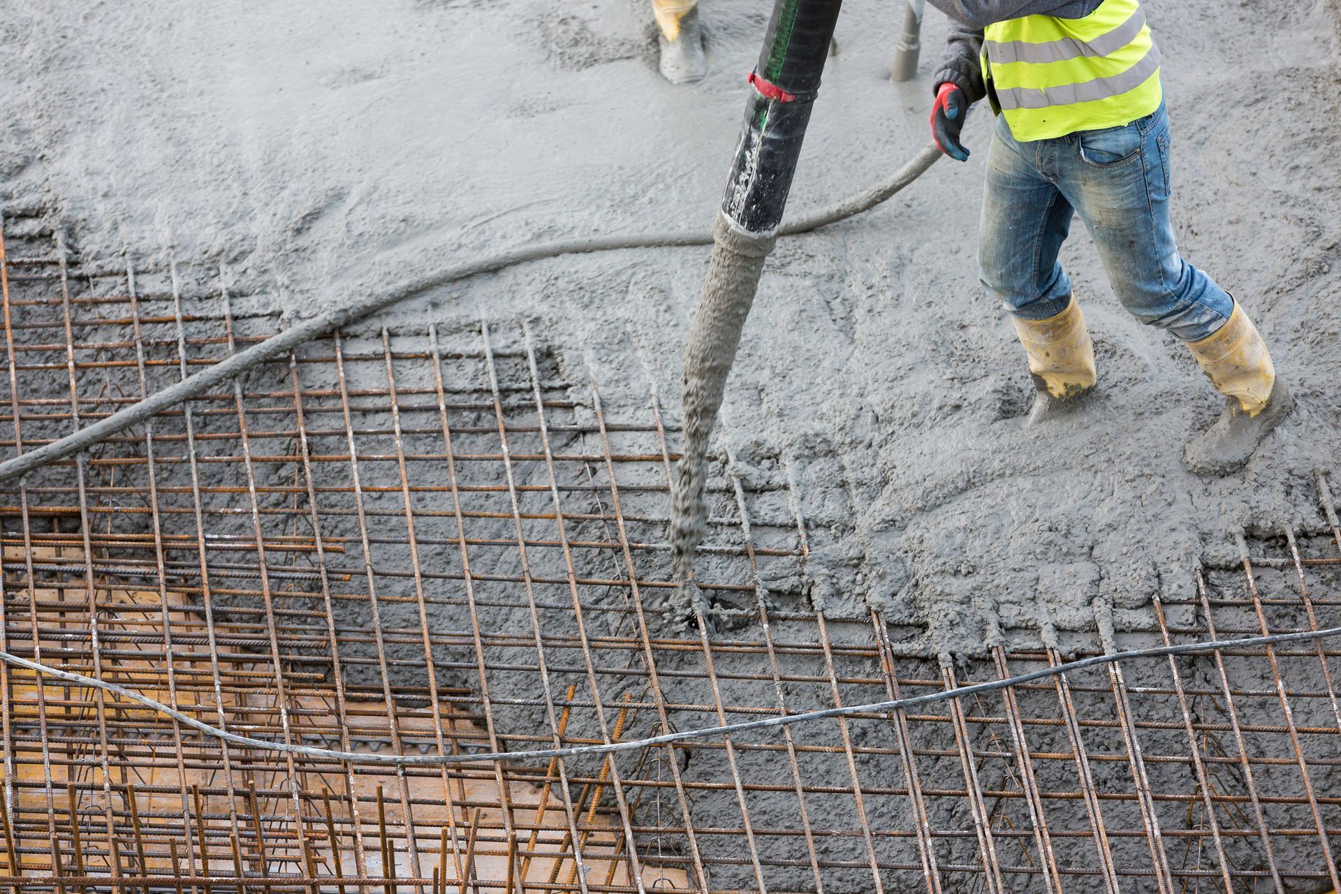 Worker from Teague Rental Equipment pumping concrete at a construction site in Slidell, LA