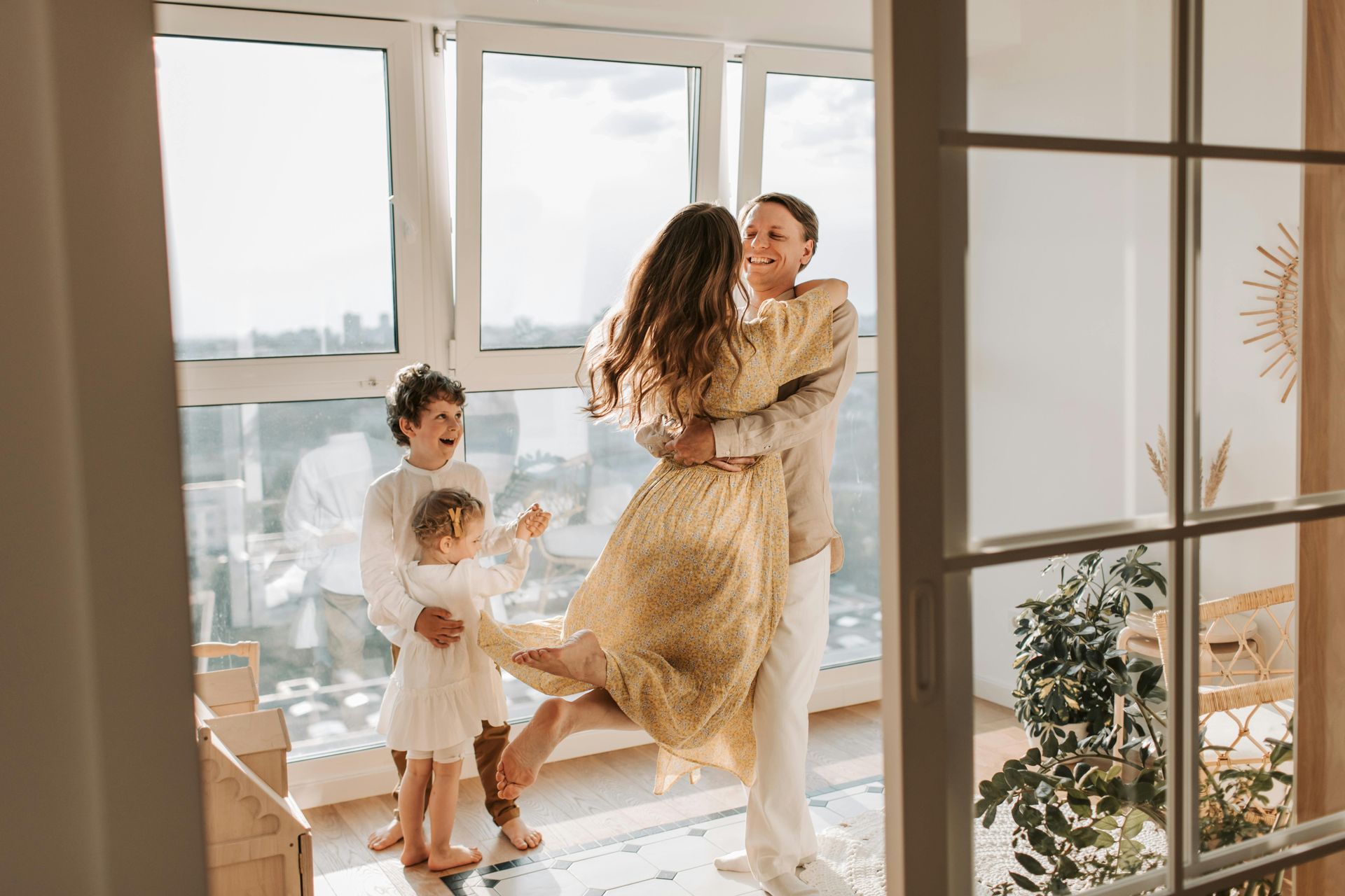 A family of four having a picnic at a park.