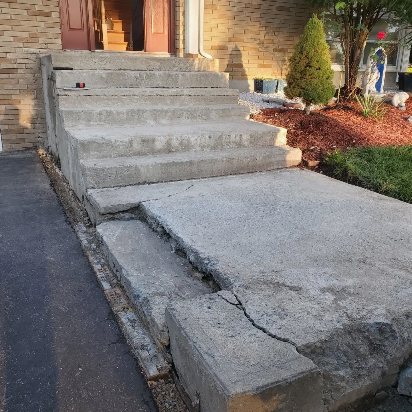 A set of concrete steps leading up to a house