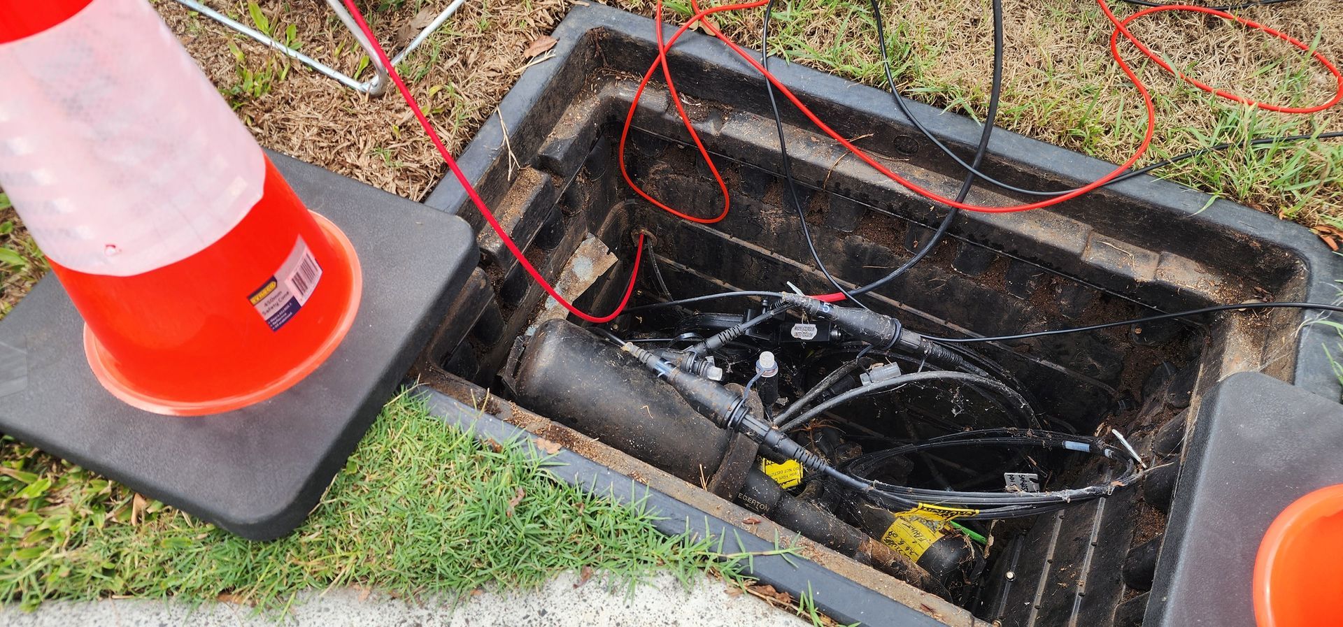 Open Utility Box With Red Wires, Orange Cone — Found It Down Under in Glenwood, QLD