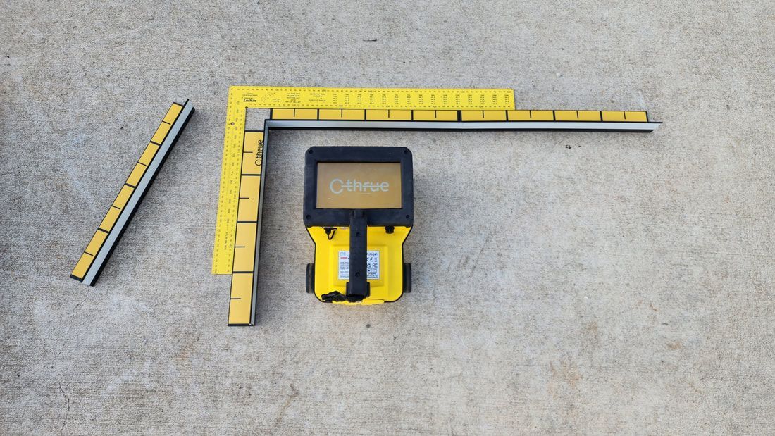 Yellow Construction Tools, Rulers, and a Handheld Detector, on a Concrete Surface — Found It Down Under in Glenwood, QLD