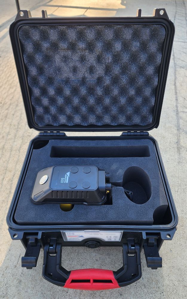 Open Hard Case With a Blue Device and Accessories Inside on a Carpeted Floor — Found It Down Under in Fraser Coast, QLD