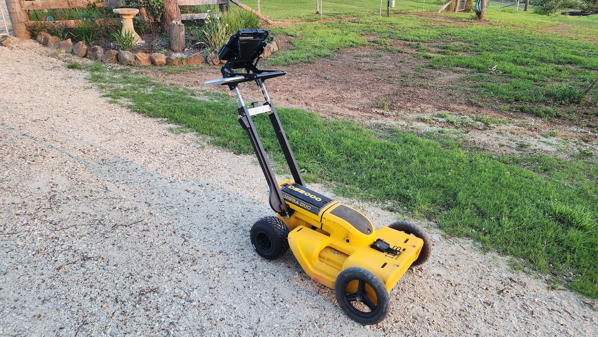 Yellow and Black Push-operated Lawn Mower on Gravel Path, Handle With Display — Found It Down Under in Widgee, QLD
