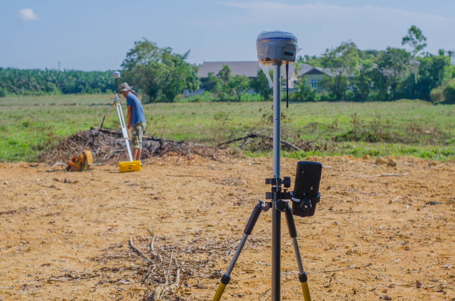 Surveyor Uses Equipment in a Field — Found It Down Under in Curra, QLD
