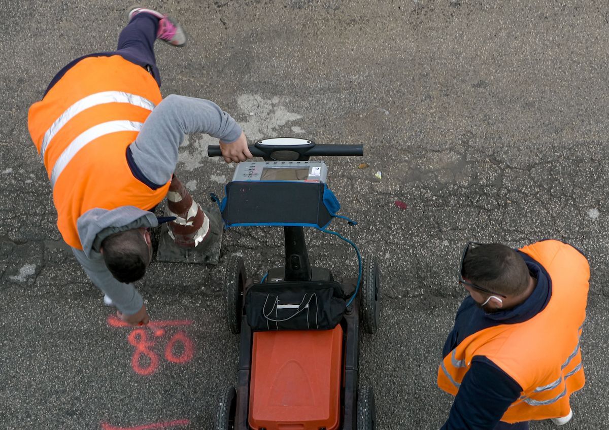 Two People in Orange Vests Use Ground-penetrating Radar on Asphalt — Found It Down Under in Widgee, QLD