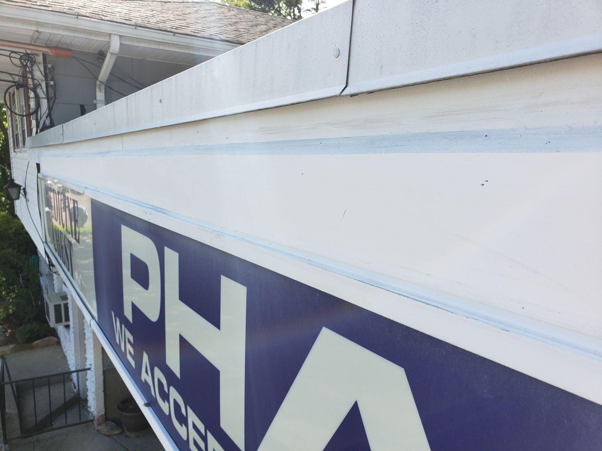 A sign on the side of a building that says ph