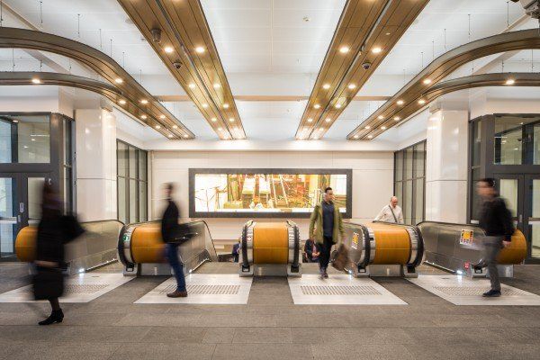 Busy lobby with people using moving walkways