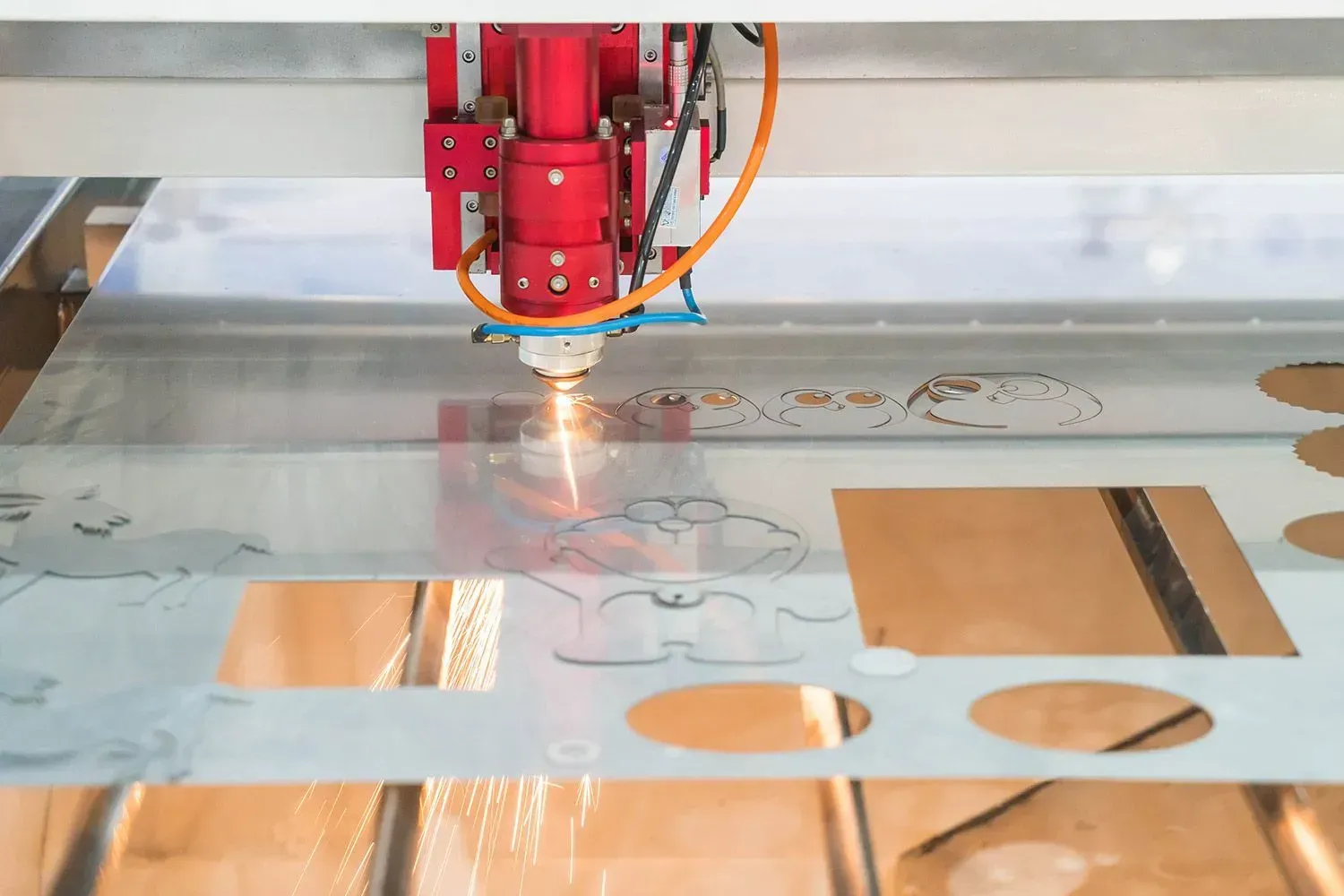 laser cutter cutting doraemon figures