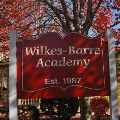 Wilkes-Barre Academy sign, maroon with silver lettering,