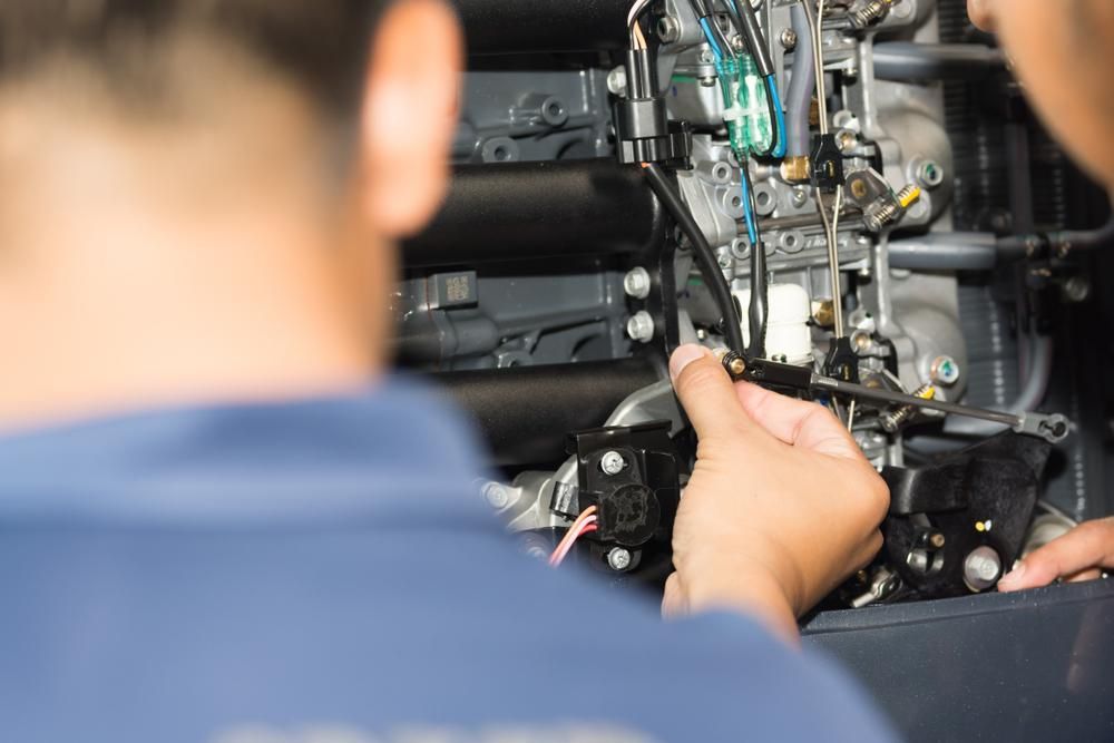 A Man Working On Some Electronics — PASMA Electrical In Torres Strait, QLD