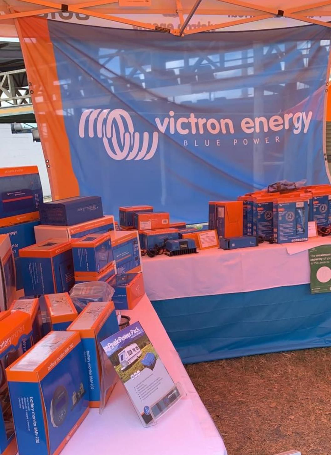 A Table With Boxes And A Sign That Says Victron Energy — PASMA Electrical In Weipa, QLD